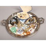 An Arts and crafts silver plated serving tray and assorted costume jewellery including simulated