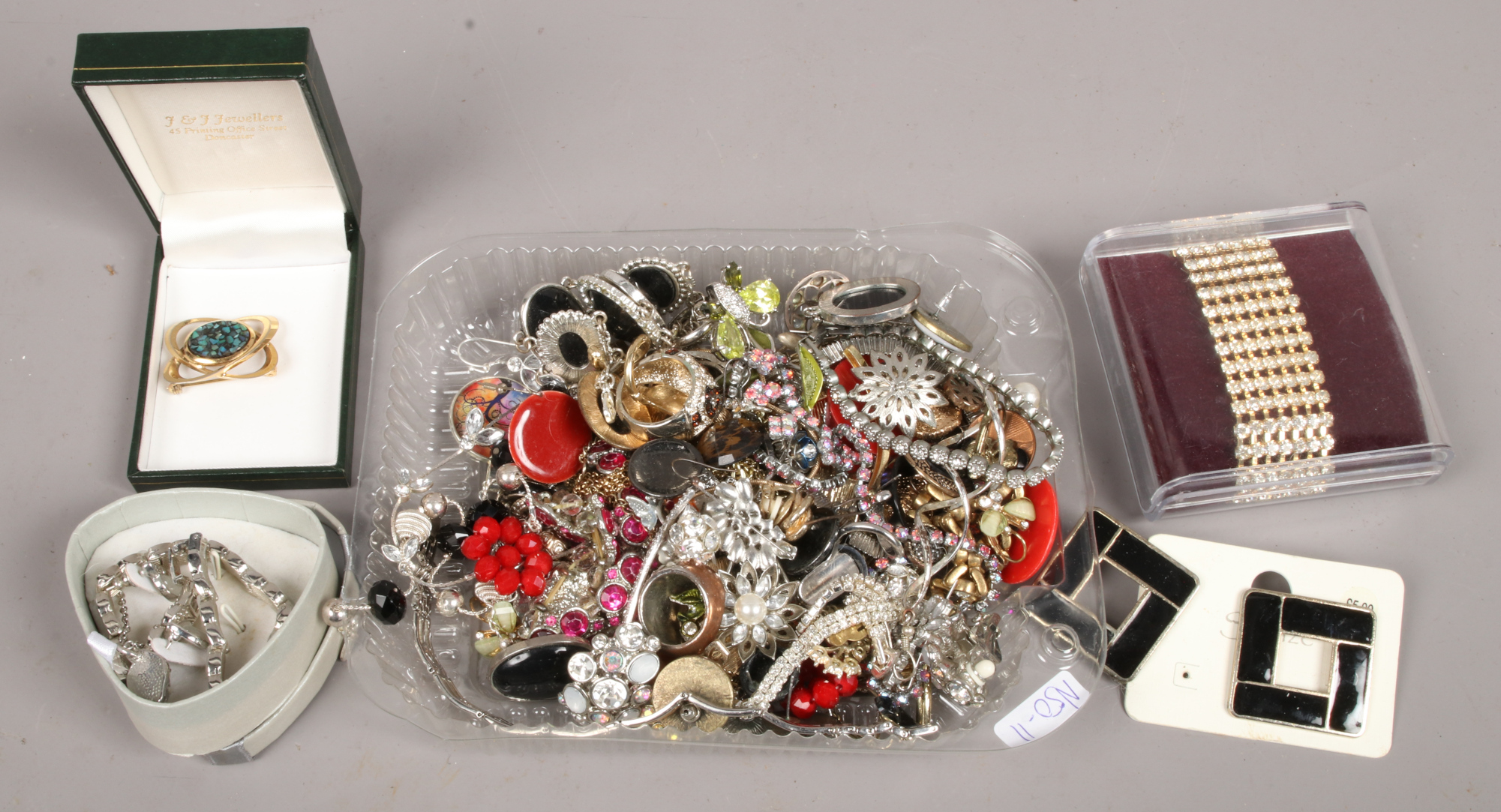 A quantity of costume jewellery including earrings, bracelets, brooches etc.