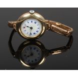 An Edwardian gold plated bracelet watch with enamel dial.Condition report intended as a guide only.