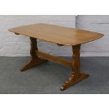 An Ercol Golden Dawn refectory table.