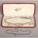 A box of vintage white paste dress jewellery.