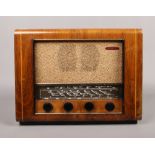 A vintage Pye radio with wood veneer.