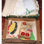 A box of linen and a box of vintage Christmas trimmings.