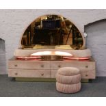 A velvet and tinted mirror dressing table with matching stool.