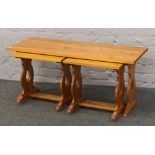 A large pine nest of three tables, width 110cm, depth 45cm.