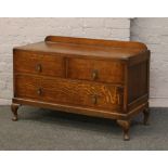 An oak  chest of drawers raised on cabriole feet width 104cm, height 64cm, depth 47cm.