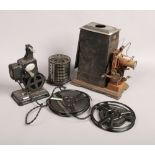 An early 20th century hand crank projector by J. Falk, along with a pathescope kid projector 9.5mm.