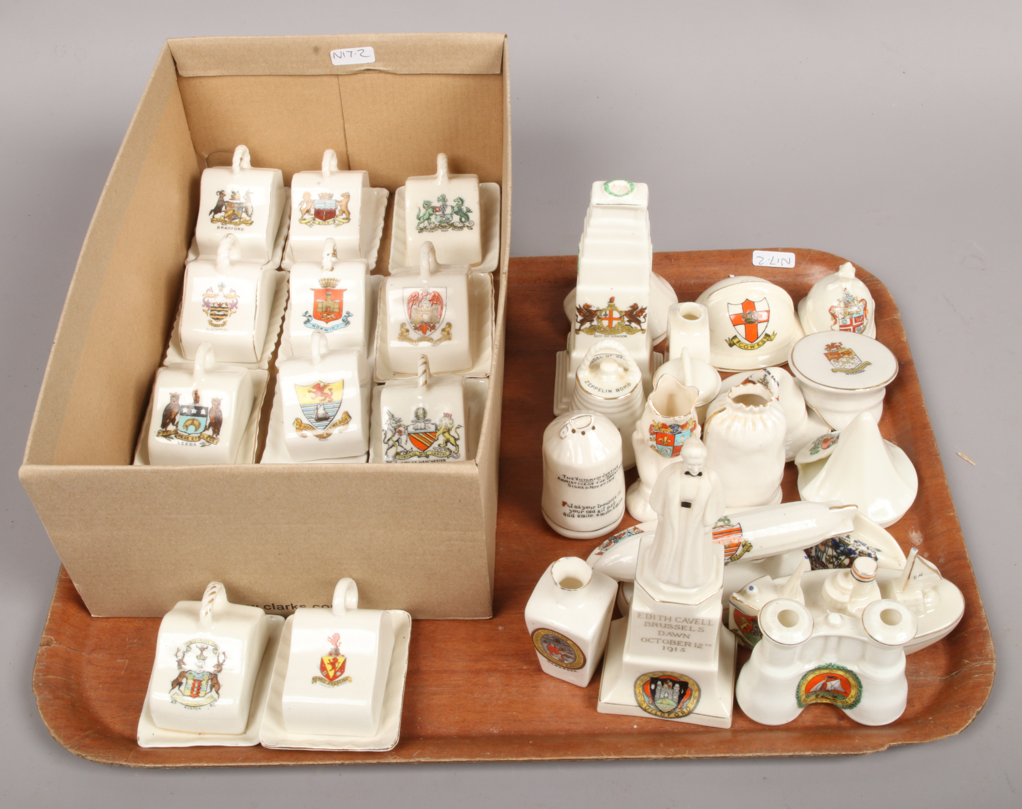 A tray of World War One crested china along with a box of crested miniature cheese dishes.