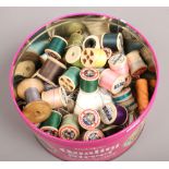 A tin of cotton reels including mostly Sylko, Clark & Co's etc.