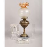A brass oil lamp along with a frosted glass oil lamp shade and clear glass lustre (in need of
