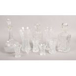 A collection of cut glassware's to include decanters, vases etc.