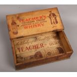 A vintage wooden advertising crate for Teachers Whisky.