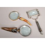 Three horn handled magnifying glasses.