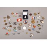 A collection of badges and brooches to include Armed Forces, Civil Defence, Royal Army Service Corps