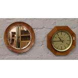 A teak cased octagonal quartz wall clock and a teak framed bevel edge wall mirror.