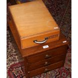 An oak table top chest of three drawers, along with a single drawer example.