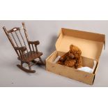 A boxed Johni Jacobsen Gund teddy bear Chesterfield, along with a dolls teddy bears rocking chair.