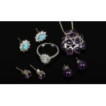 A suite of silver and opal earrings and dress ring, along with a silver and amethyst pendant on