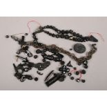 A box of miscellaneous jet items to include brooches, bracelets, cross, necklaces etc.