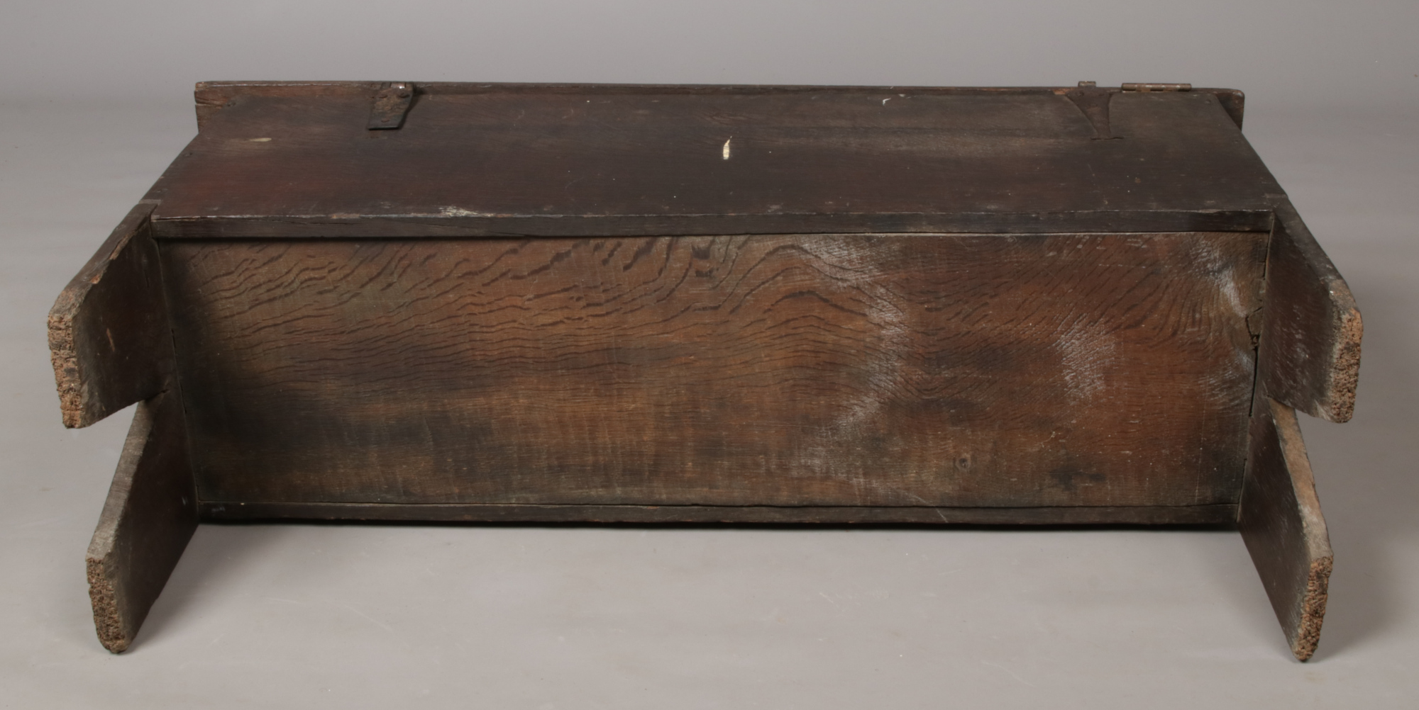 A 17th century boarded oak coffer. With exposed tenons to the side planks, carved medallions to - Image 5 of 5