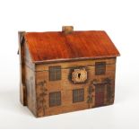 A novelty painted tea caddy, modelled in the form of a cottage with a pitched roof and two chimney