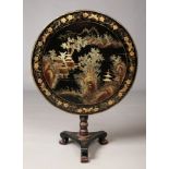 A Japanese Meiji period lacquered tilt top occasional table. Decorated in gilt to the circular top