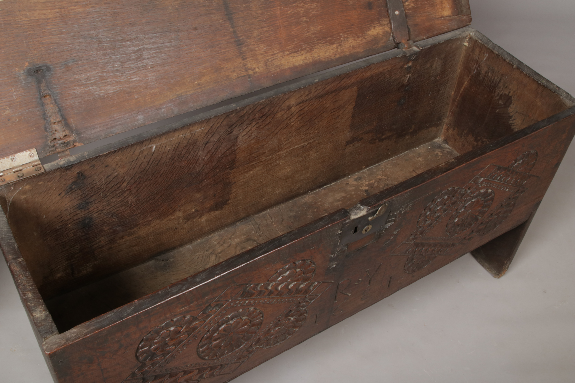 A 17th century boarded oak coffer. With exposed tenons to the side planks, carved medallions to - Image 3 of 5