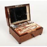 A 19th century French burr walnut necessaire raised on squat bun feet. With hinged and mirrored