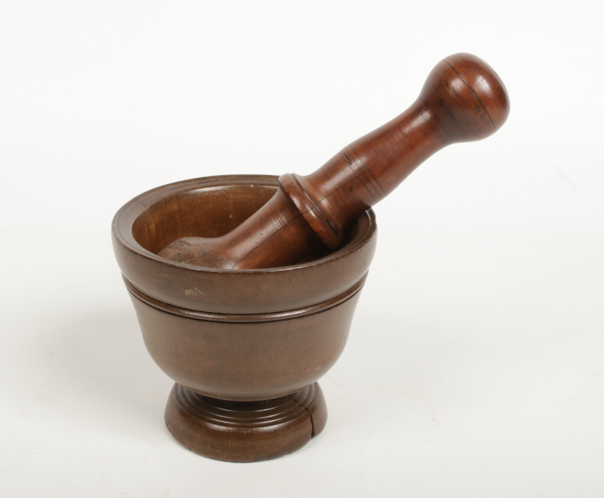 A 19th century French treen mortar and pestle. Pestle 19.5cm. Condition report intended as a guide