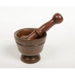 A 19th century French treen mortar and pestle. Pestle 19.5cm. Condition report intended as a guide