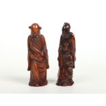 Two 19th century Chinese carved bamboo figures. One formed as a sage holding a feather the other