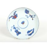 An 18th century Chinese saucer dish decorated in the Ducai tradition. Depicting four precious