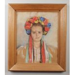 E. Osen (mid 20th century) pastel portrait of a young woman in colourful floral headdress. signed