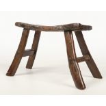 A period oak estate built small stool. With concave plank top, exposed tenons and splay supports,