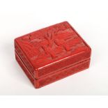 A 19th century Chinese cinnabar lacquer rectangular box and cover. Decorated to the top with a