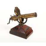 A detailed model of a Gatling gun. Mounted on an adjustable base for elevation, with ten barrel