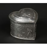 A 19th century Hanau silver repousse heart shaped box with hinged cover. With a continuing landscape