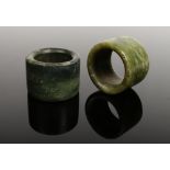 Two Chinese carved jade archers rings.Condition report intended as a guide only.Surface scratches