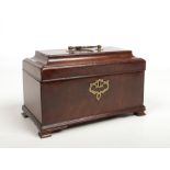 A Georgian mahogany tea caddy. With brass mounts and raised on ogee bracket feet, 25cm wide.