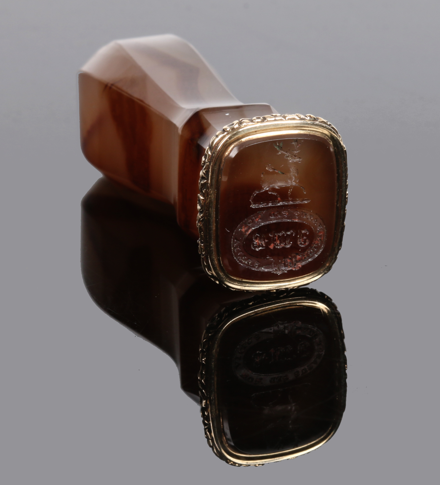 A 19th century banded agate desk seal with gilt metal mount. The small rectangular matrix carved