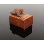 A miniature Japanese carved pillbox. Formed as a working drawer and surmounted with a toad.