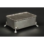 A George V silver ring box by William Henry Leather. The hinged top with engraved banding and