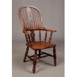 A Victorian ash and elm pad arm Windsor chair. With pierced splat and double turned cross stretcher.