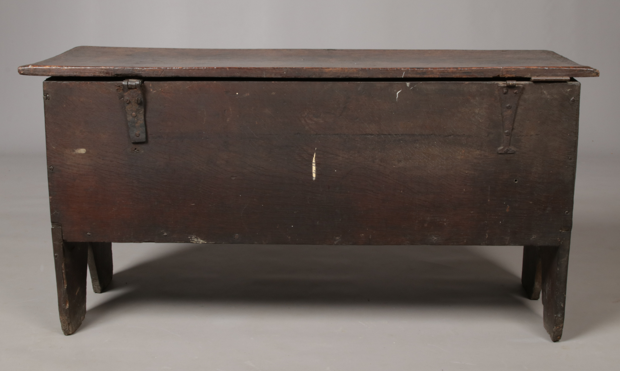 A 17th century boarded oak coffer. With exposed tenons to the side planks, carved medallions to - Image 4 of 5