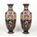 A large pair of Japanese Meiji period cloisonne hexagonal baluster vases. Ground in dark blue and