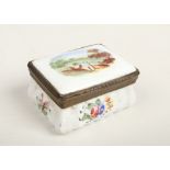 An 18th century Staffordshire enamelled rectangular snuff box with hinged cover. Decorated to the