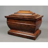 An early Victorian mahogany wine cooler of stepped sarcophagus form and with original liner, 77cm