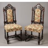 A pair of Victorian carved oak Gothic revival side chairs. With eagle heads surmounted upon the