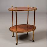 An early 20th century French two tier kingwood oval cocktail trolley. Crossbanded and with gilt