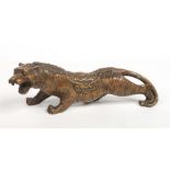 A 20th century Chinese small bronze sculpture of a tiger with line of ancient coins along his spine.